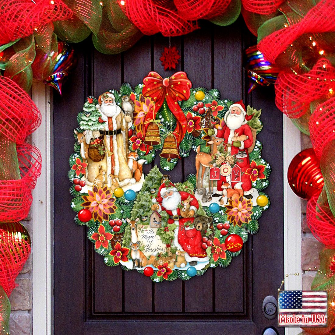 Christmas wreath with Santa and snowman figures, greenery, berries, and poinsettias