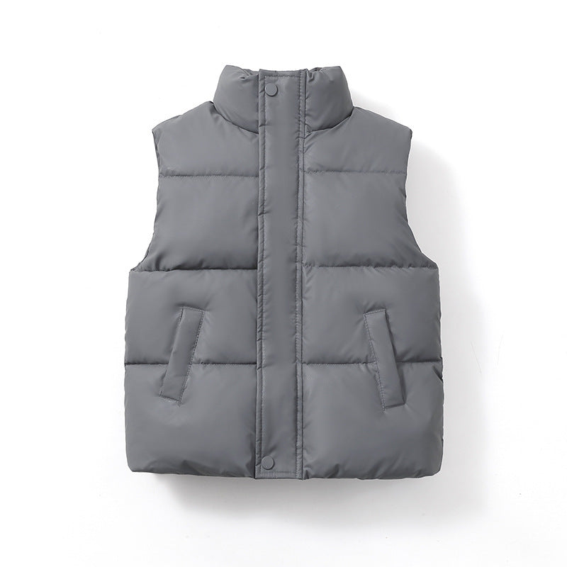 Children’s padded puffer vest coat in light gray, zip-front with stand collar and patch pockets