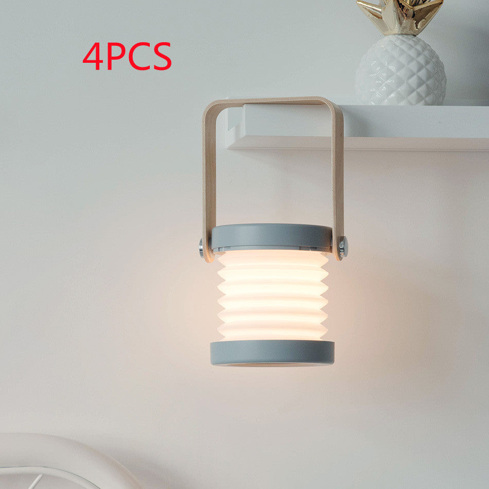 Foldable LED lantern with ribbed shade, light wood frame and gray trim