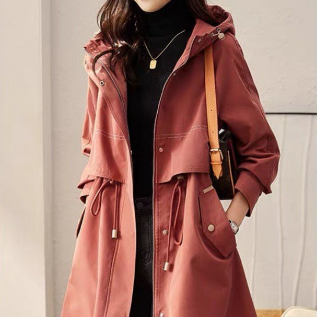 Women's hooded windbreaker coat in muted reddish-brown, drawstring waist, button front