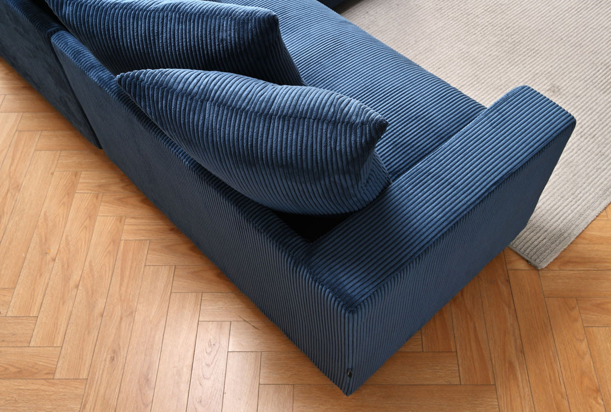 Blue striped sectional sofa with chaise corner and thick, textured cushions