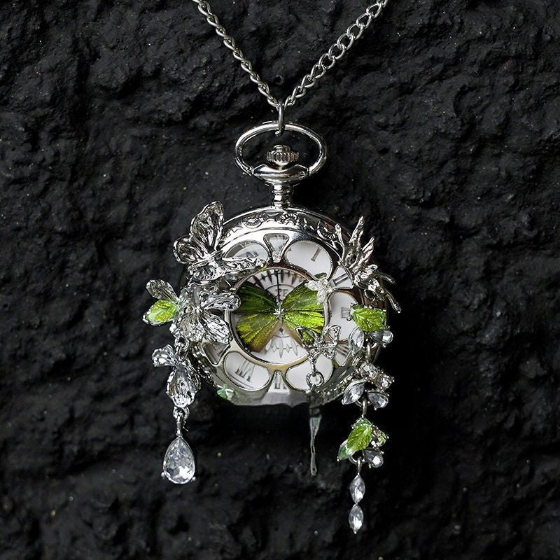 Butterfly pocket watch pendant necklace with green butterfly accents and dangling crystals