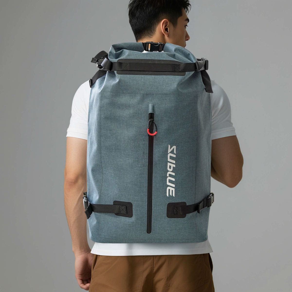 Back view of 52L waterproof backpack in blue-gray with padded straps and carry handle