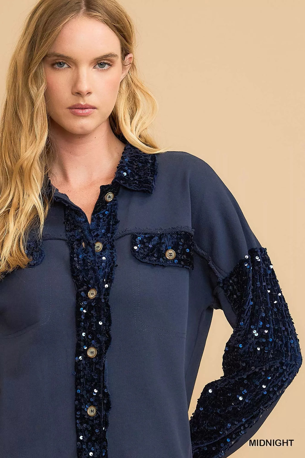 Midnight blue sequined French terry jacket close-up with button placket and chest patch