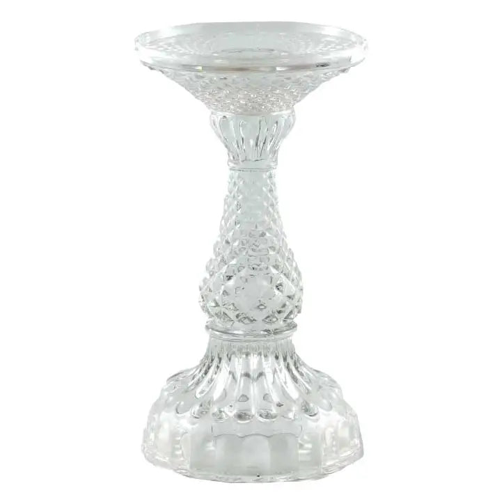 Clear glass pillar candle holder with wide top and faceted pedestal base