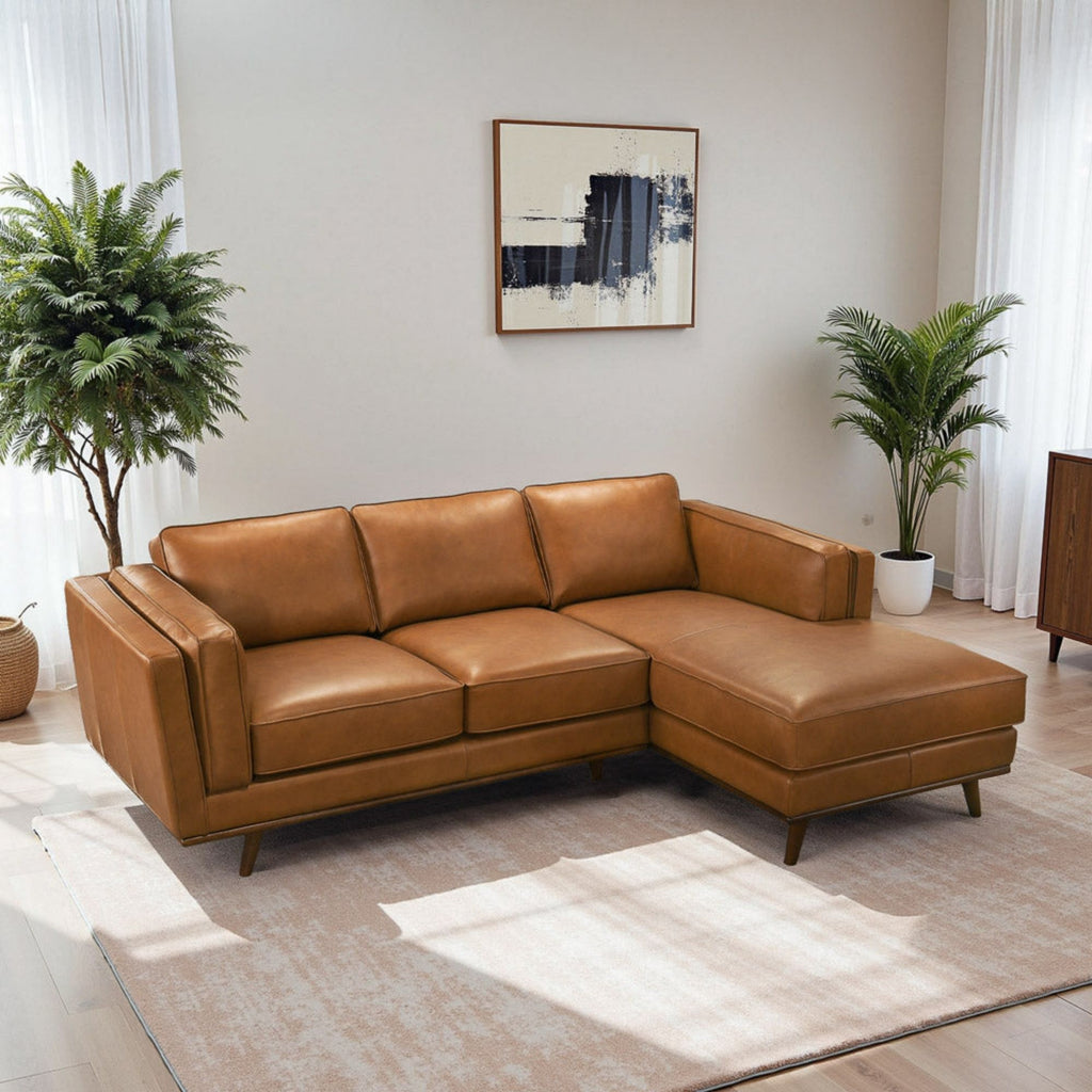 Light brown sectional sofa with corner section, tuftless seat cushions and wide armrests