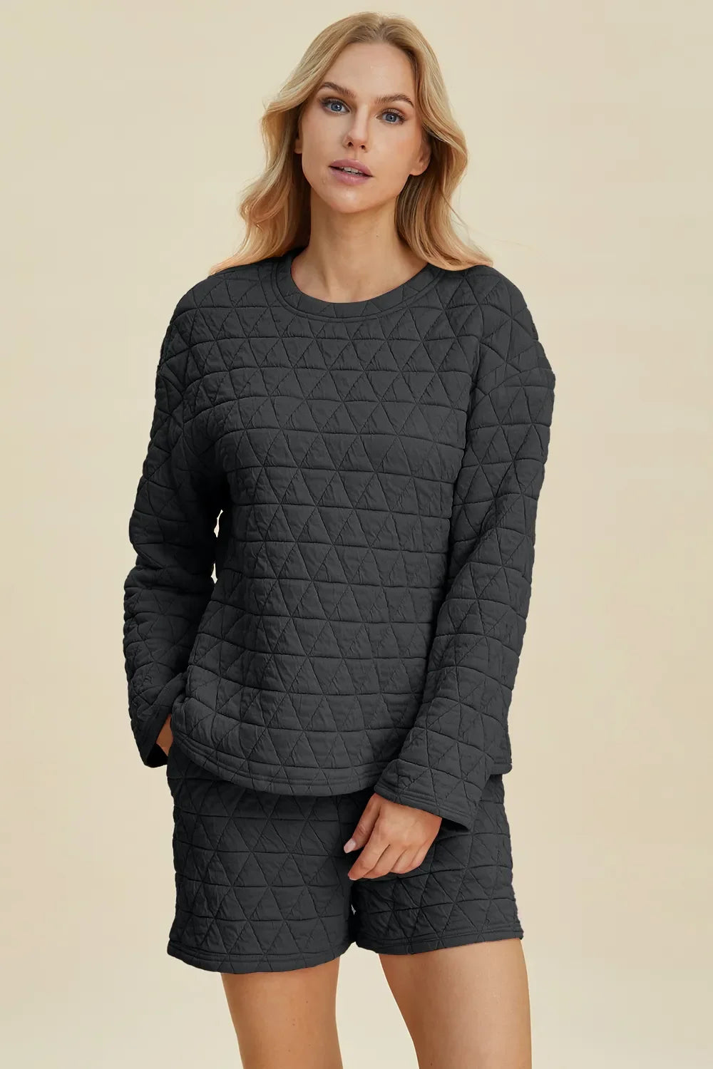 Textured black long-sleeve top and matching shorts set with diamond quilt pattern