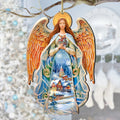 Wooden angel ornament with orange-gold wings and blue dress holding a nativity scene