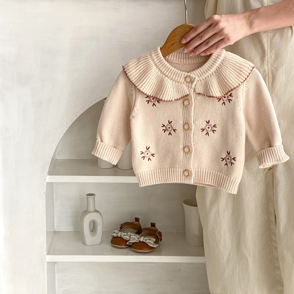 Stone powder knitted baby coat with Peter Pan collar, button-front and floral embroidery