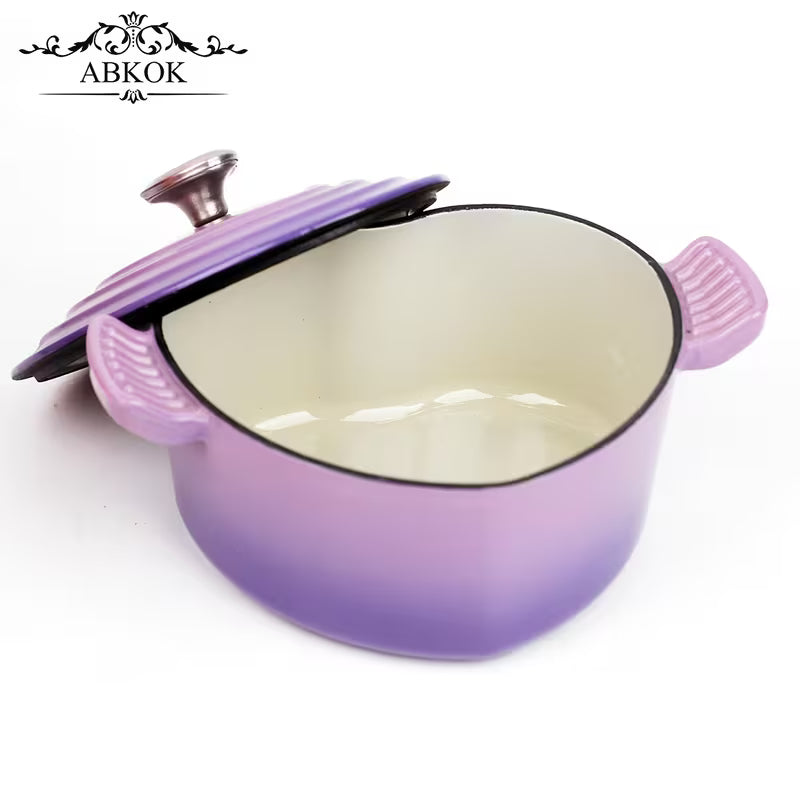 Purple enamel cast iron Dutch oven body with lid removed, black rim and cream interior