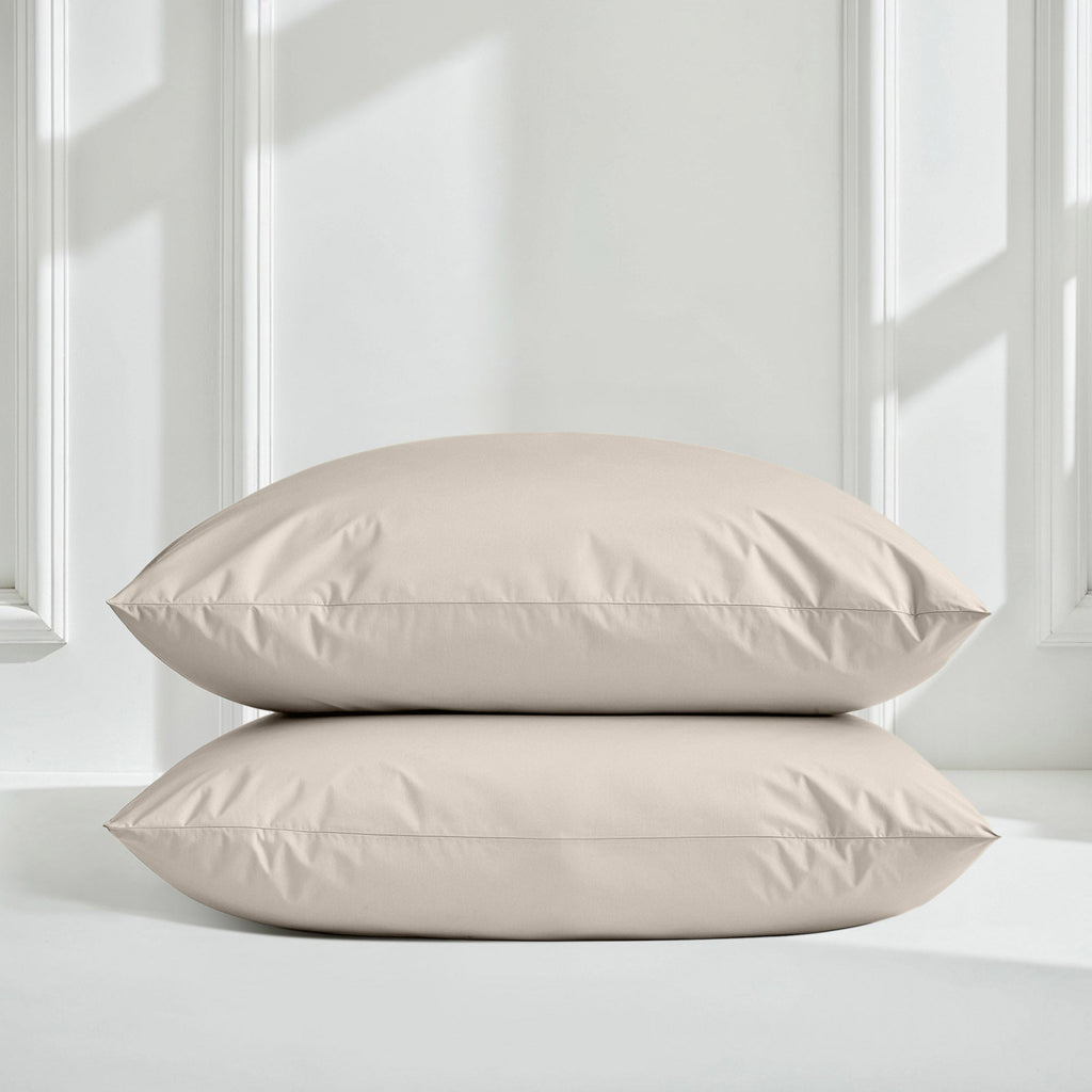 Sateen bedding set with stacked comforter and pillows in light beige/taupe color