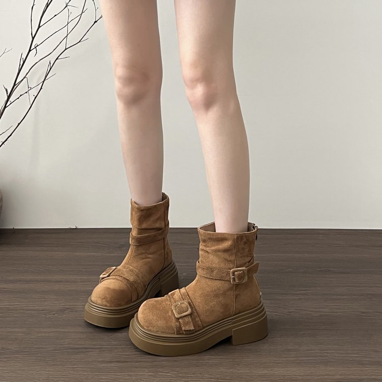 Brown suede low ankle boots with platform sole and buckle strap closure
