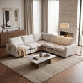 White L-shaped modular sectional sofa with plush cushions and wide chaise seat