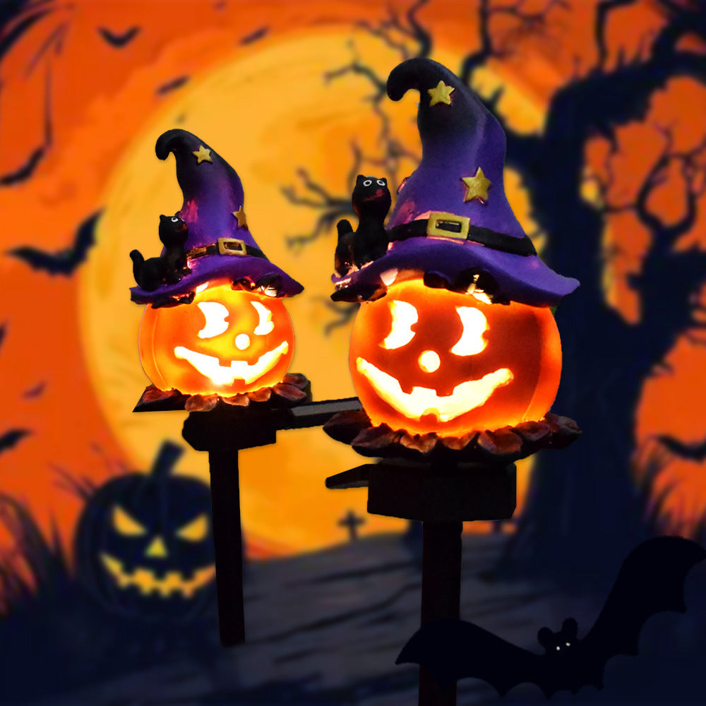 Solar Halloween pumpkin lantern stake light pair with purple witch hats and glowing jack-o’-lanterns