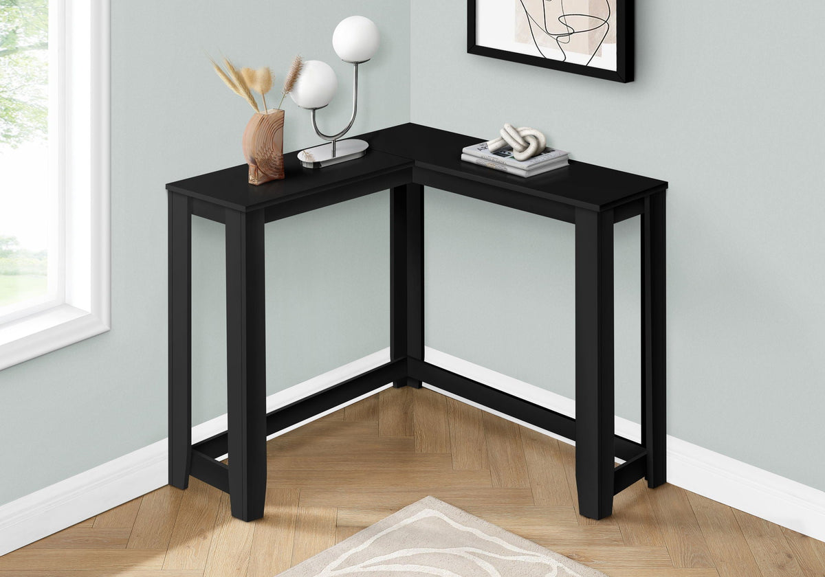 Corner accent console table in black finish with squared legs and open corner frame.