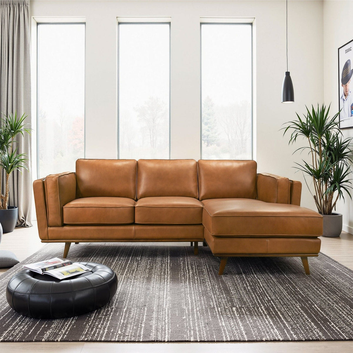 Light brown sectional sofa with chaise, multiple seat cushions and low, tapered wooden legs