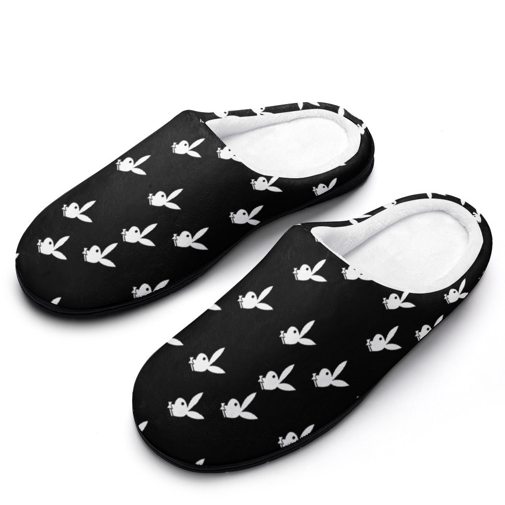 Black cotton slippers with white bunny pattern, slip-on style and cushioned lining