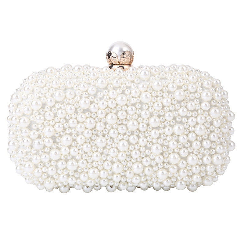 White pearl bead oval clutch with round metal clasp, front view