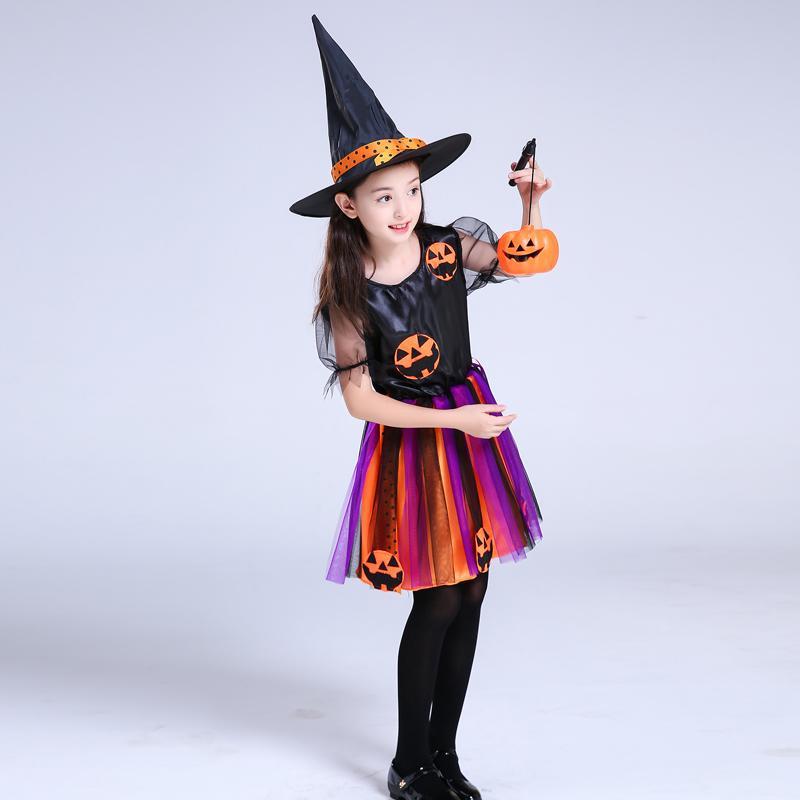 Children's witch costume with pointed hat, jack-o-lantern top, rainbow striped tulle skirt