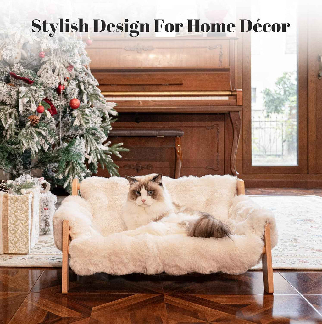 Wooden cat couch bed with a plush cream cushion and raised sides.