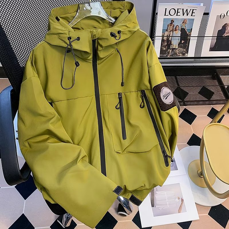 Green men's waterproof windproof soft shell jacket with hood, zip front, chest pockets