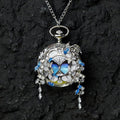 Butterfly pocket watch pendant necklace with blue butterfly accents and silver-tone crystal drops