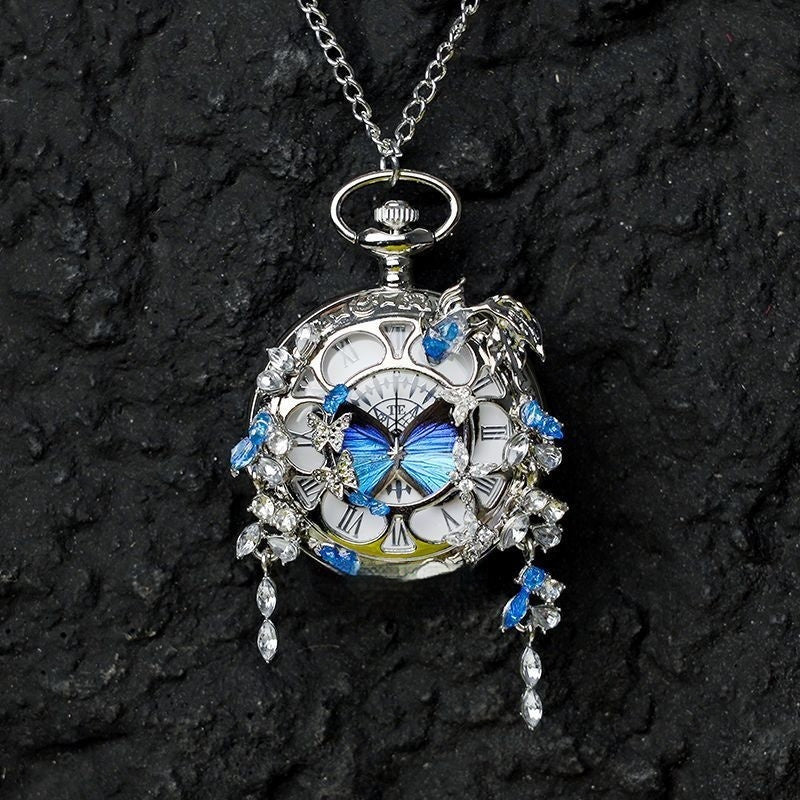 Butterfly pocket watch pendant necklace with blue butterfly accents and silver-tone crystal drops