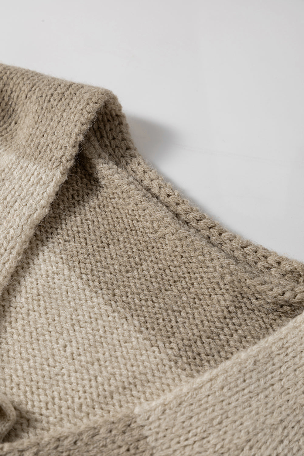 Beige chunky knit fabric swatch with textured woven pattern