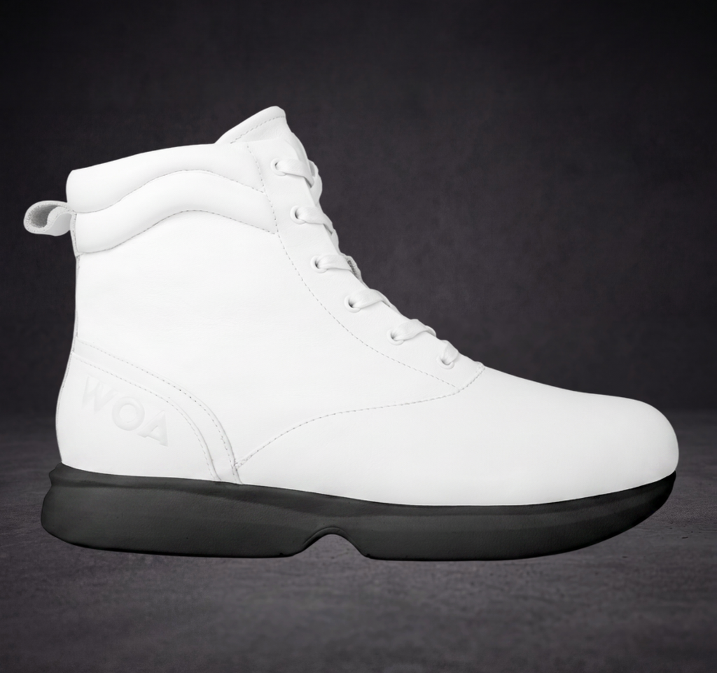 White WOA boot with lace-up front, padded collar, and black rubber sole