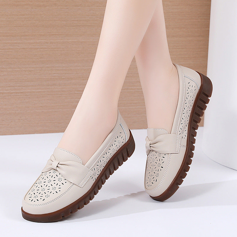 Women’s beige perforated flat loafers with knot detail and dark rubber sole