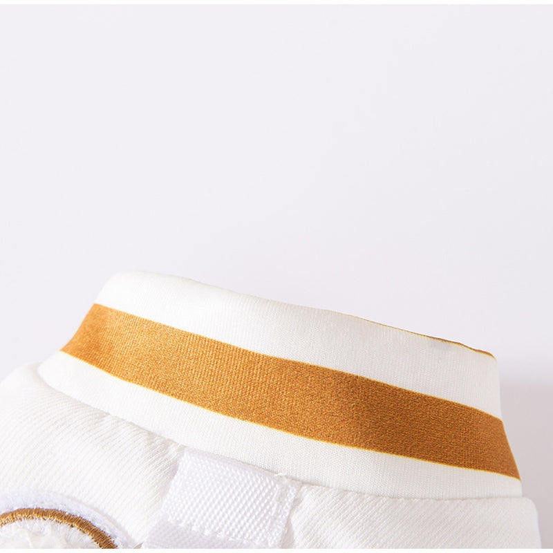 White padded dog jacket with brown striped trim