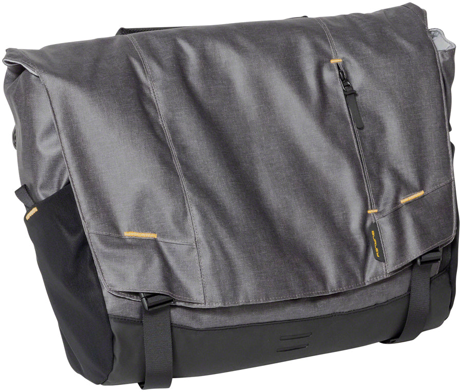 Black nylon messenger bag with front flap and zip pocket