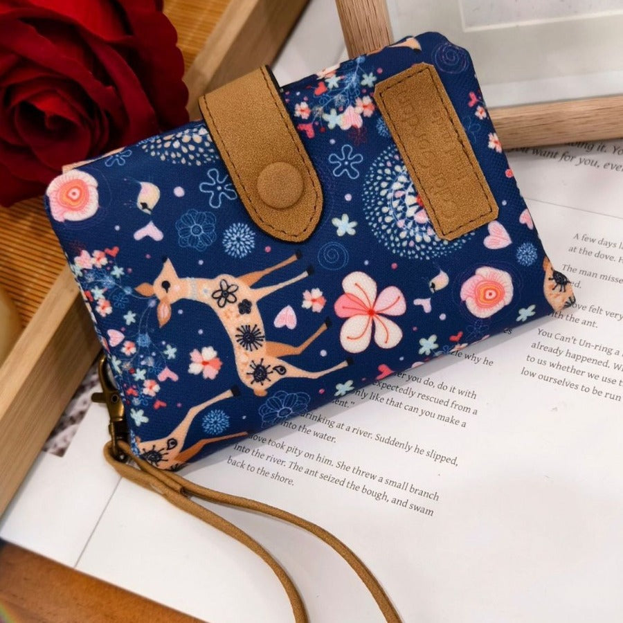 Printed tri-fold wallet with snap button and wrist strap, blue floral animal pattern