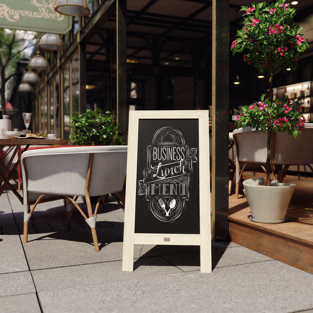 A-frame black chalkboard sign with light wood frame and chalk menu design