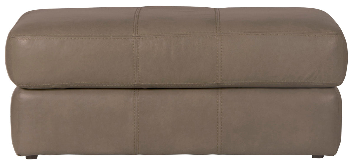 Chocolate brown fabric ottoman with rounded top and stitched panels, low legs