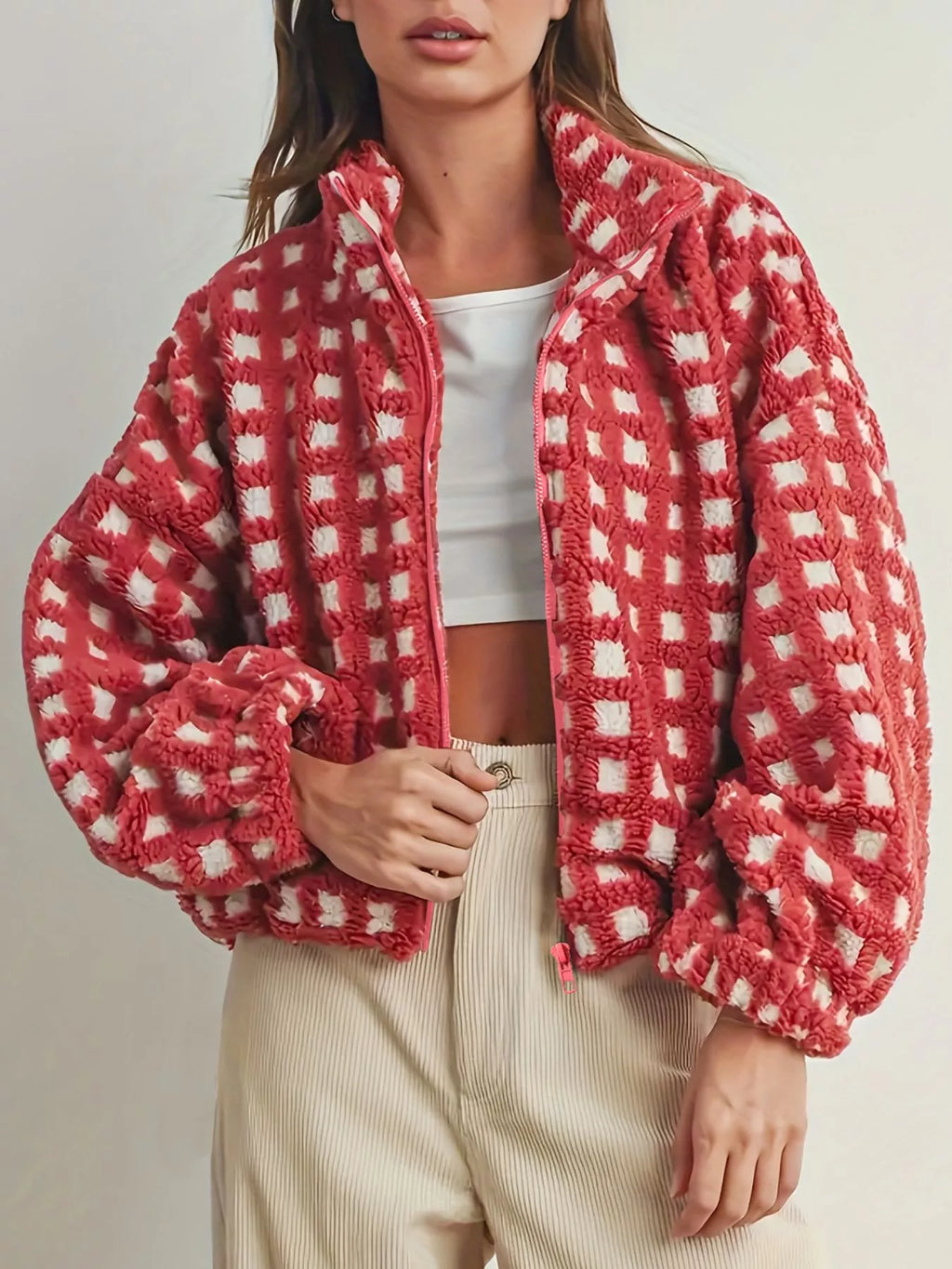 Red plaid sherpa zip-up jacket with full front zipper and cozy fleece texture