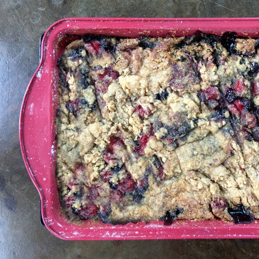 Baked gluten free cookie mix in a pink baking dish
