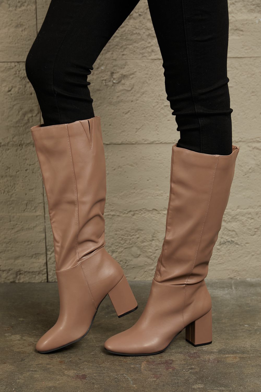 Mocha knee-high block heel boots with pointed toe and visible side seam