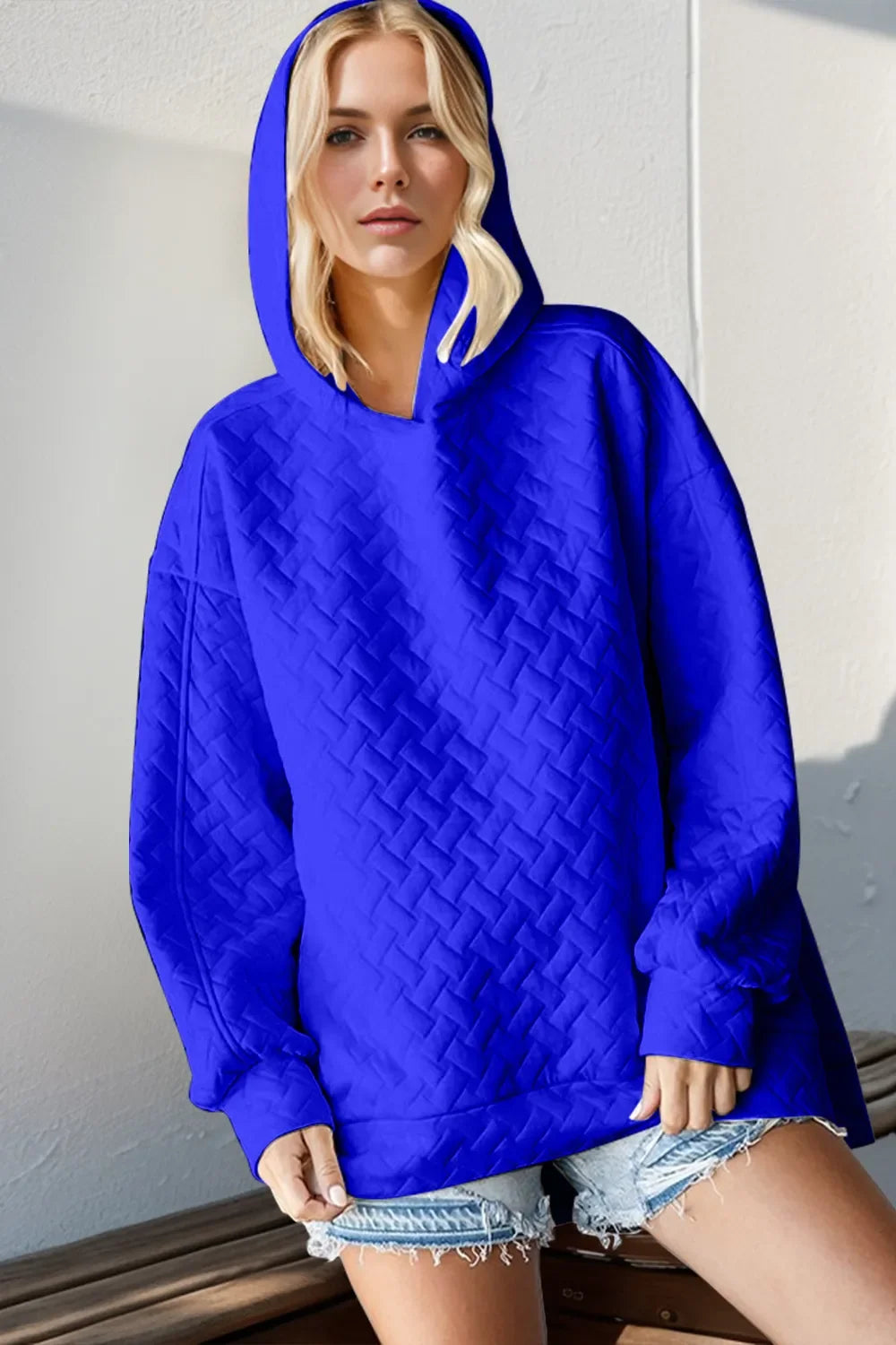 Royal blue textured drop-shoulder hoodie with hood and long sleeves