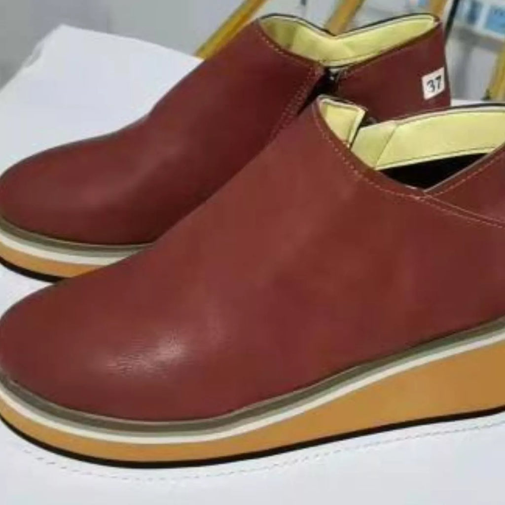 Burgundy ankle wedge boots with side zipper and striped platform sole