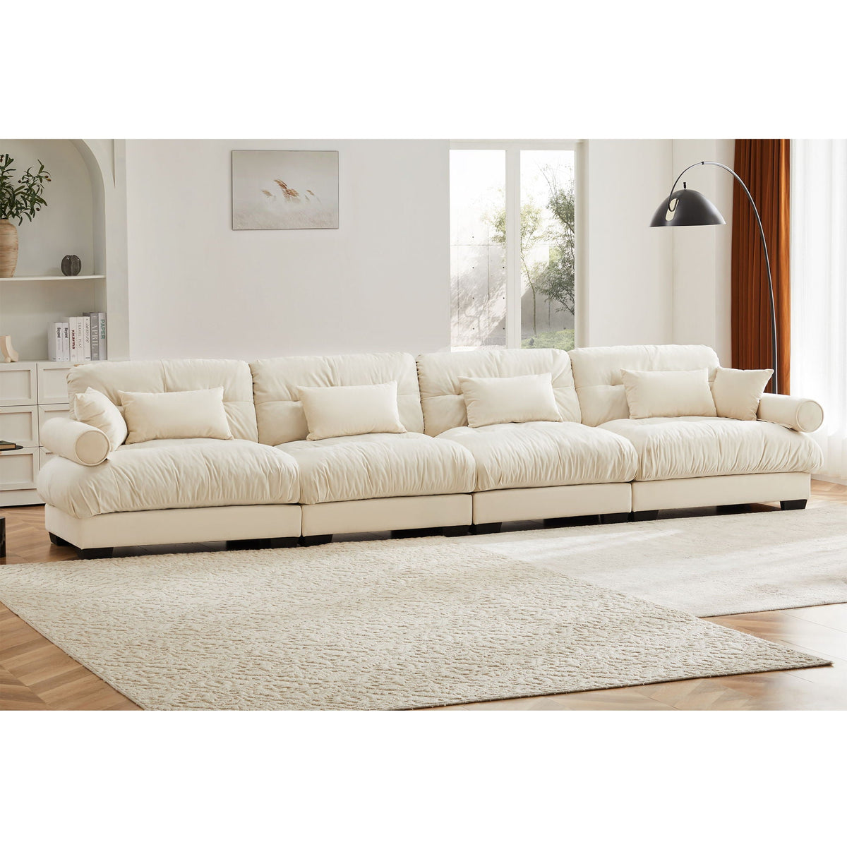 Beige modular sectional sofa with deep cushions, rolled arms, and low block legs
