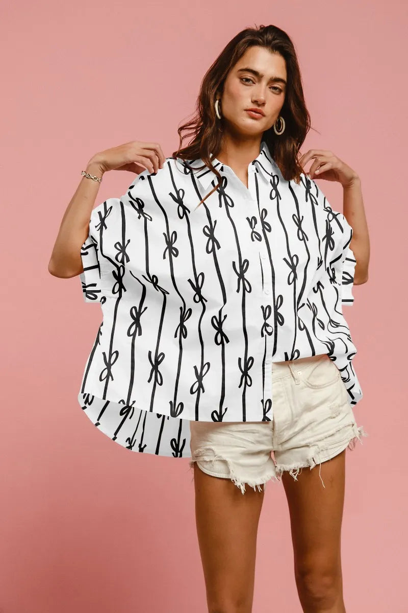 Off-white and black printed button-down shirt with short sleeves and front buttons