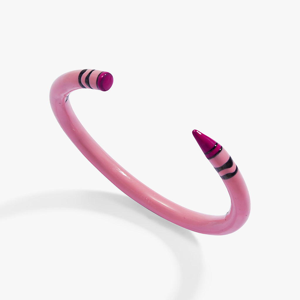 Pink crayon-style cuff bracelet with purple striped end tips