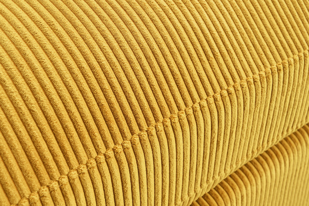 Mustard yellow corduroy-style sectional sofa chaise with plush striped upholstery