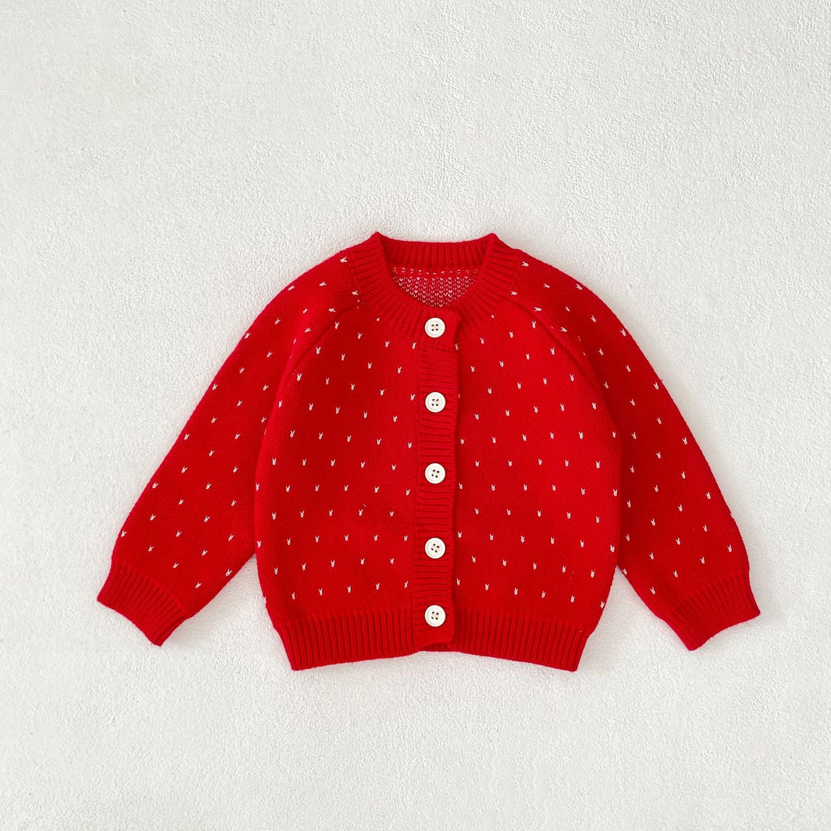 Red dot-pattern knit cardigan with button placket and long sleeves