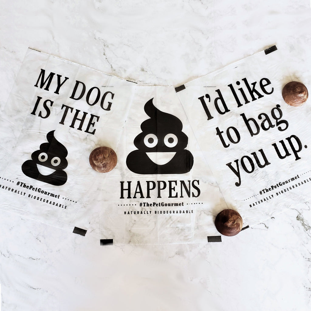 Biodegradable dog poop bags with black graphic icons and text, flat lay view