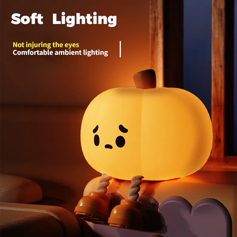 Soft silicone pumpkin lamp with sad face, warm ambient light for bedside decor