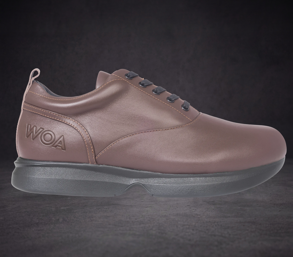 Men’s taupe WOA low-top dress sneaker with dark laces and sculpted rubber sole
