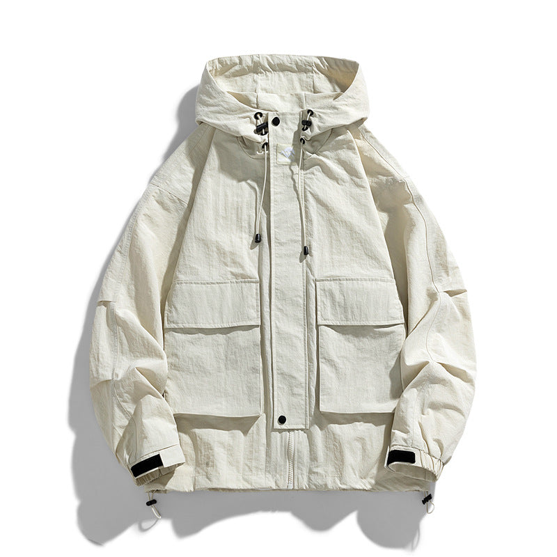 Ivory hooded zip-up work jacket with front pockets and adjustable drawstring hood