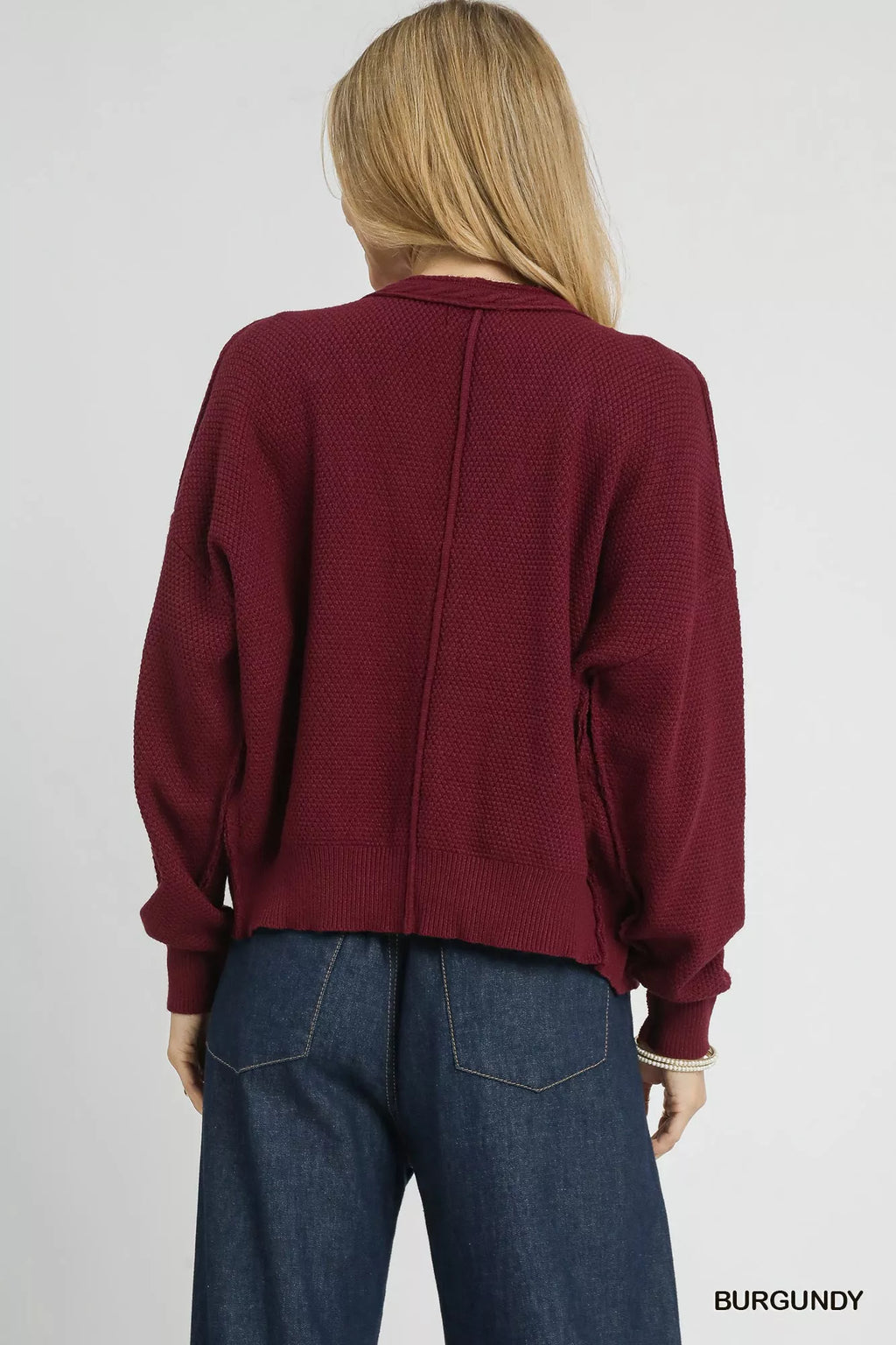 Burgundy chunky cable-knit V-neck button cardigan, long sleeves, back view